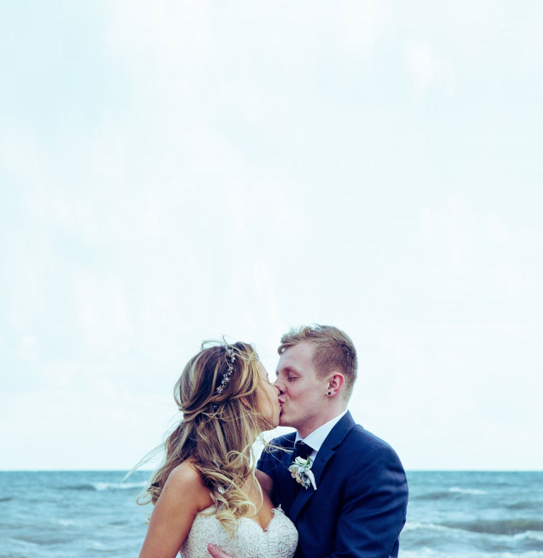 Couple kissing by the sea
